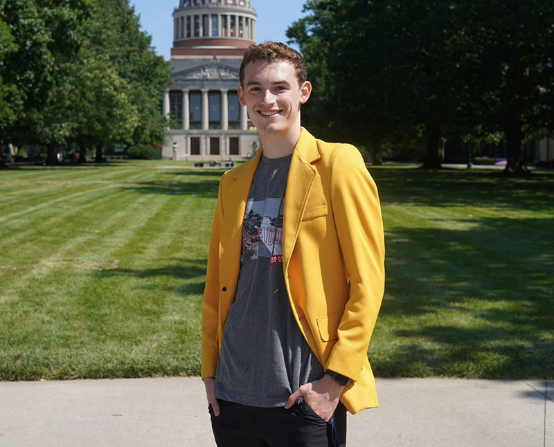 Ethan R. King ’27 in front of a University of Rochester building on River Campus. 