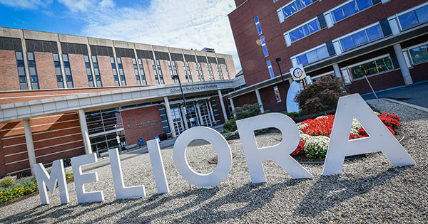Meliora banner outside of the School of Medicine and Dentistry