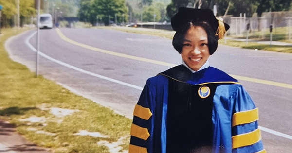 Joanne Y. Law ’98 (PhD) in her cap and gown