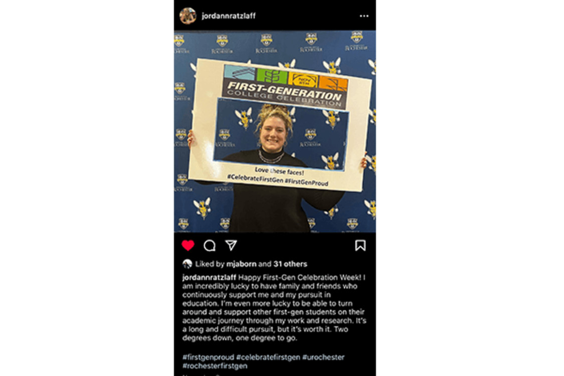 Image: Student poses with sign celebrating First-Generation College Celebration Day