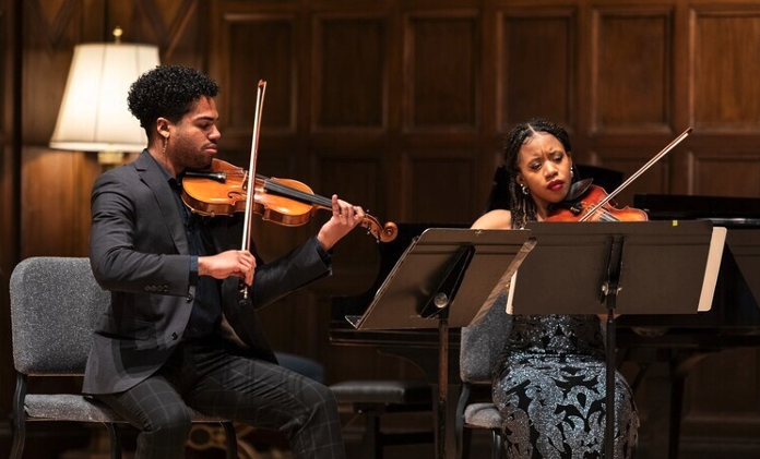 Two students performing 