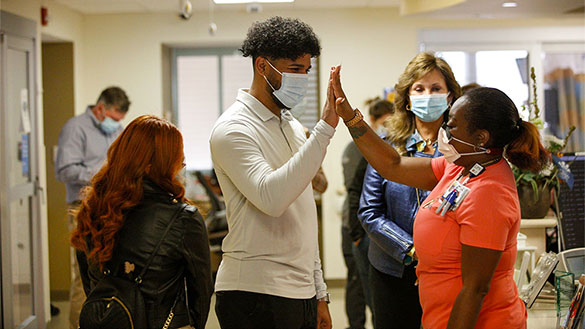 Brito returns to visit with the staff who saved his life.