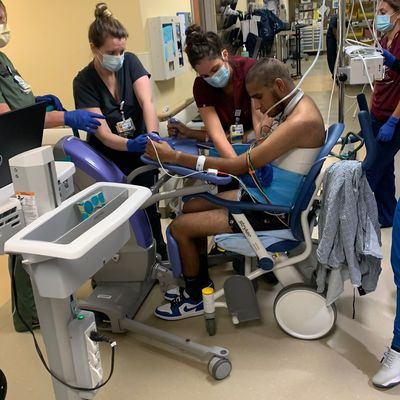 Daniel Brito attended to by hospital staff