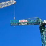 Large construction crane with blue sky in background