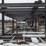 metal framing of new building covered in snow