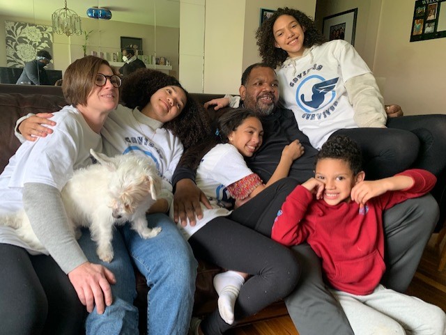 Jeffrey Reese and his family piled on a sofa