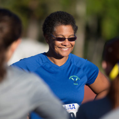 Lisa Norwood smiling in sunglasses outdoors