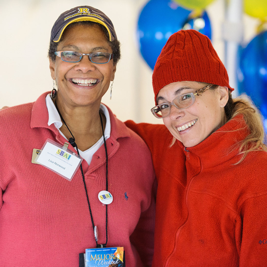 Lisa Norwood posing with an alumnae in casual clothing during meliora weekend