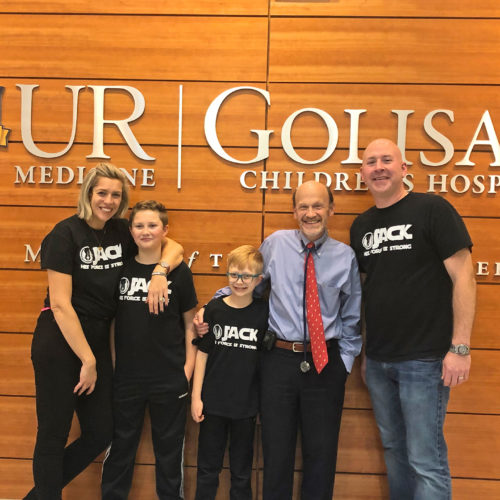 The Harrison family with Dr. Korones, celebrating the conclusion of Jack's chemotherapy treatment in 2019.