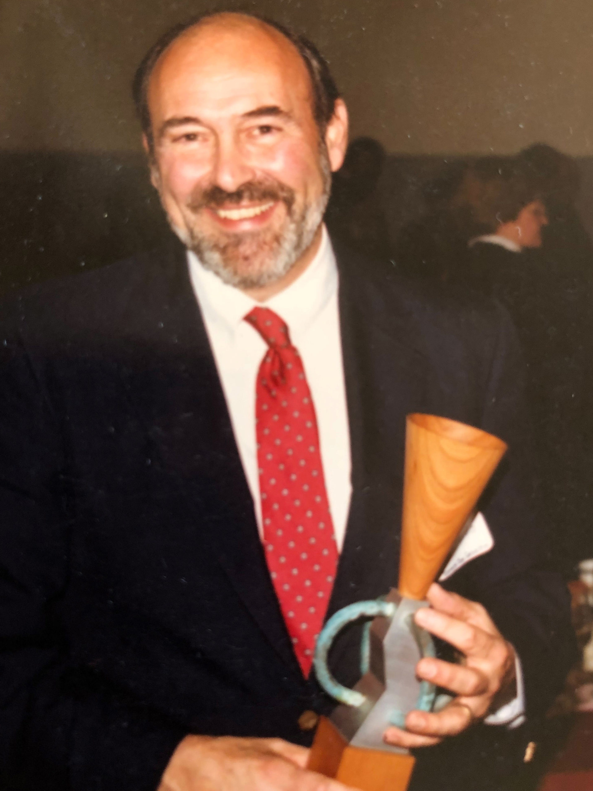 Bob Sperandio holding an award