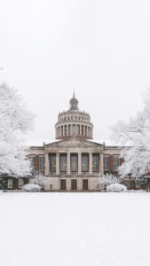 Rush Rhees library with snow capped trees December mobile download