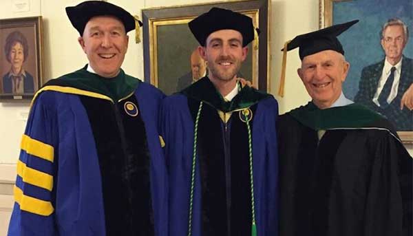 Kevin J. Geary ’83M (MD), ’88M (Res), ’90M (Flw) poses with his nephew, Michael Geary ’16M (MD), and his father, Joseph Geary, at Michael’s graduation from SMD dressed in graduation regalia