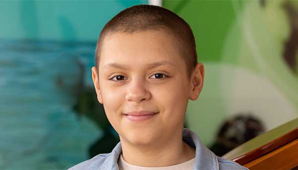 Jeyliana Gonzalez - young boy smiling for the camera with short hair
