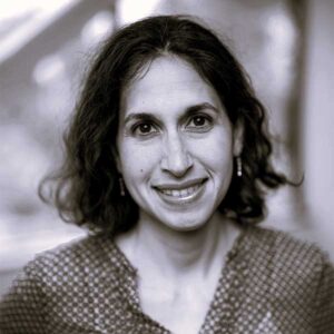 black and white headshot image of Dina Uzri