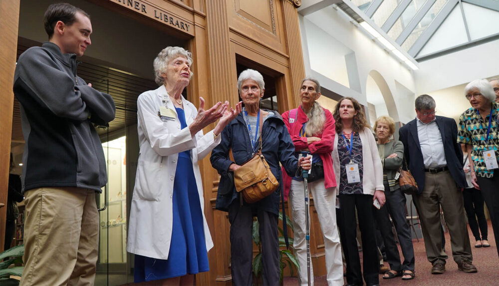 Dr. Lawrence in front of the Miner Library while leading a tour of “The Heritage Trail” for returning alums during Meliora Weekend, 2016.