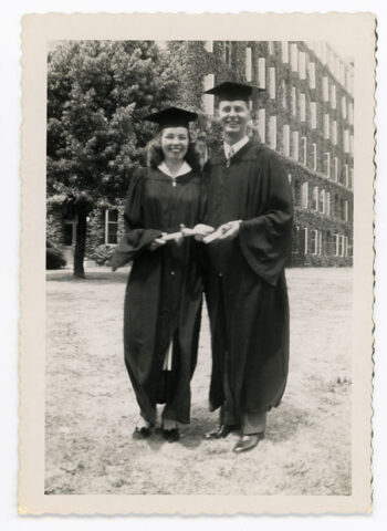 In caps and gowns, Ruth Anderson MD on URSMD Graduation Day standing beside her classmate and fiancé, Robert Lawrence MD, Class of 1949.