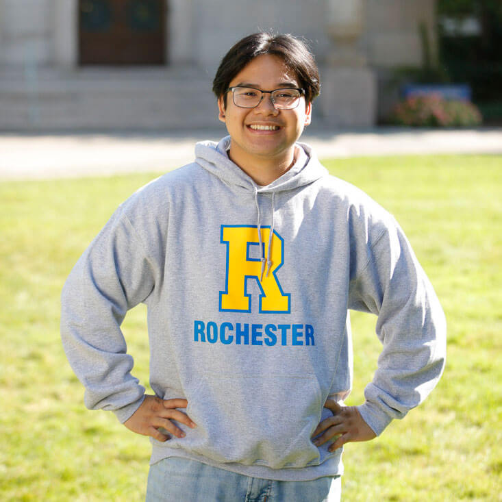 Student wearing a Rochester Hoodie