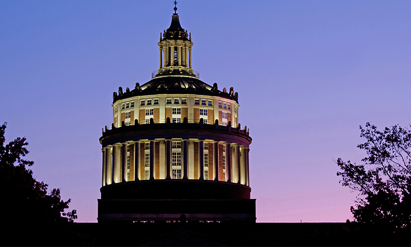 Rush Rhees library tower against an evening sky