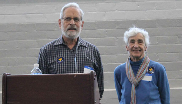 Dick and Vicki Schwartz standing at podium during event