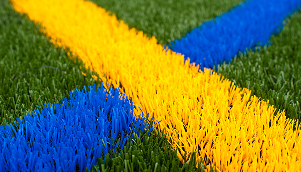 Turl lawn with UR yellow and blue lines criss crossing
