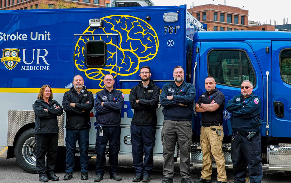 psychnp-classroom Stroke unit team stand in front of a MCU