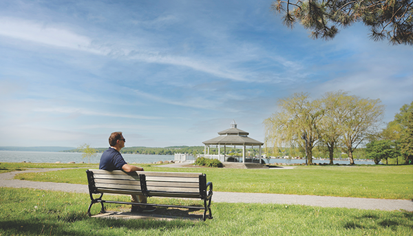jake 600x343 Jake sitting on a bench overlooking Lake Canandaigua