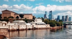 A scenic view of a body of water with buildings located nearby within Philadelphia.