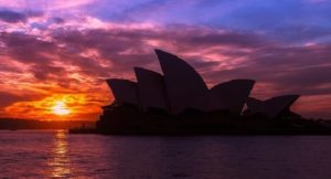 Photo of Sydney Opera House with the sun setting in the background