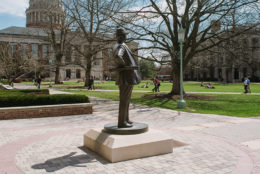 Eastman quad in background with status of George Eastman in foreground
