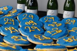 blue decorative cookies with yellow 29 on them