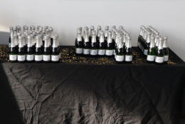table with a bunch of bottles of champagne