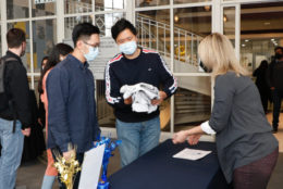 students checking in at event table receiving their tshirts