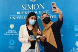 two women posing in photo booth