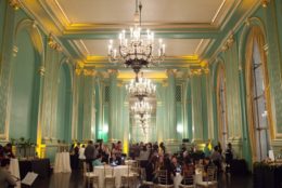 large ballroom with tables and guests