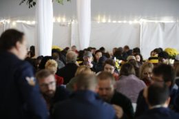 large crowd in an event tent