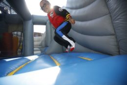 kid jumping on bounce house