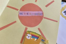 homemade greeting card that says be the sunshine and a sloth on it