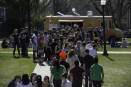 large crowd in line for food truck
