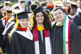 students posing for photo during after commencement