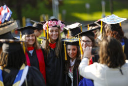 students posing for photo during after commencement