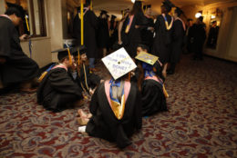 Students wait patiently as they are told its almost time to walk to their seats