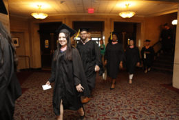 graduates walking into the theatre