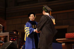 President Richard Feldman congratulates a graduate