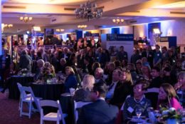 ballroom full of tables and people