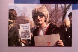 person in glasses holding up the empty closet book