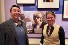 man in bowtie and woman in neck tie smiling for photo