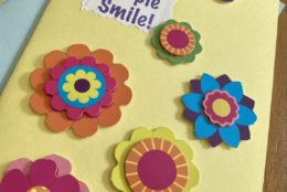 homemade greeting card with flowers make people smile and cutout flowers all over it