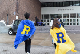 two people wearing R capes