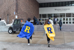 two people wearing R capes