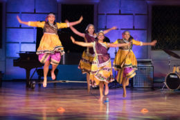 four women dancers performing on stage